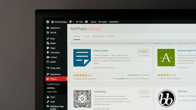 Laptop screen displaying a WordPress plugins page